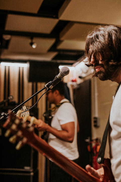 musician-playing-electric-guitar-aesthetic-photography